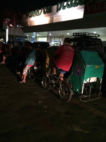At the  Mabini Side of Harrison Plaza, some pedicabs are waiting for passengers