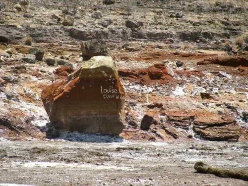 The rocks get marked with water lines. The lake level changes with the accumulation of rainwater and water evaporation.